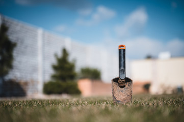 Garden shovel in grass. Gaden shovel close up.