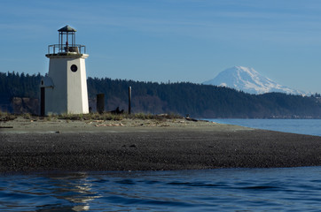 Lighthouse marking Gig Harbor entrance with Mt Rainier in the background