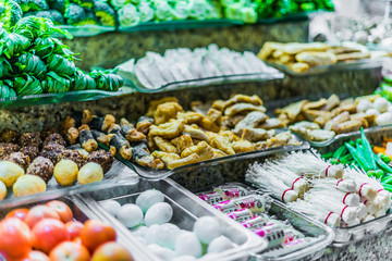Traditional Asian dishes sold in a food court in Singapore