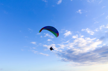 paragliding in the blue sky