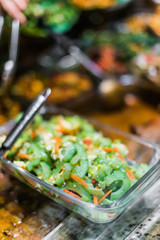 Traditional Asian dishes sold in a food court in Singapore