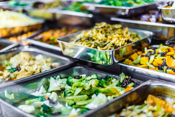 Traditional Asian dishes sold in a food court in Singapore