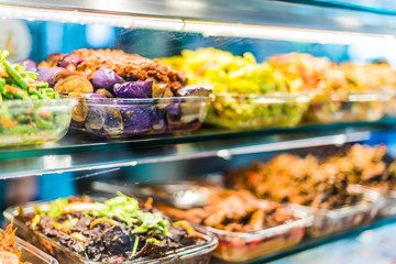 Traditional Asian dishes sold in a food court in Singapore