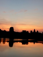 Fototapeta na wymiar Angkor Wat during sunrise, shadows before lake with reflections, ruins of Angkor, Cambodia