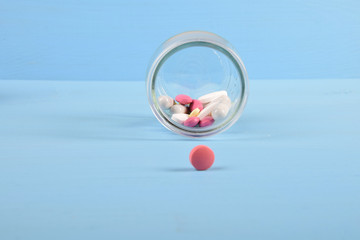 colored pills in a glass jar for immunitywith free space for text