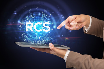 Close-up of a touchscreen with RCS abbreviation, modern technology concept