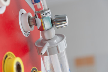 Medical oxygen flow meter with humidification bottle. Oxygen therapy is used in patient with...