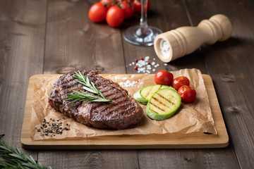 ribeye steak on a wooden board, beef. 