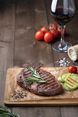 ribeye steak on a wooden board, beef. 