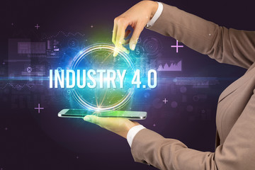 Obraz premium Close-up of a touchscreen with INDUSTRY 4.0 inscription, new technology concept