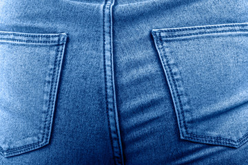 Female hips in jeans close up.