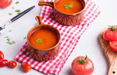 Delicious tomato soup on a light background.