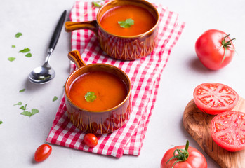 Delicious tomato soup on a light background.