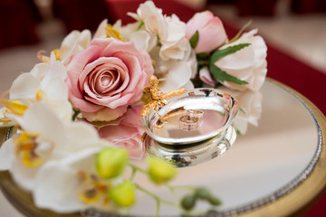 beautiful wedding rings lie in a special stand and wait until they are put on