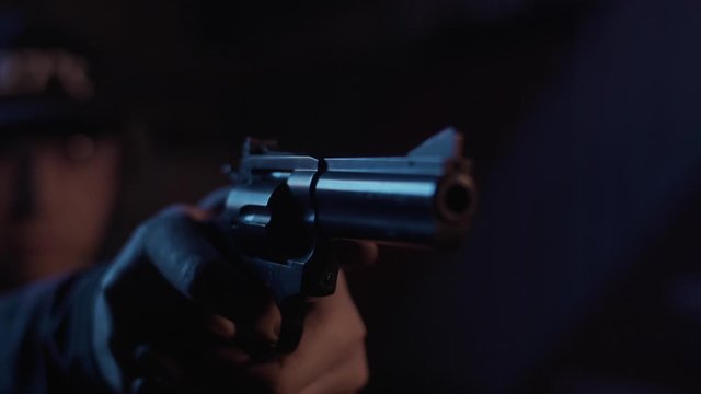 Stock video footage firearm firing of a gun in the dash