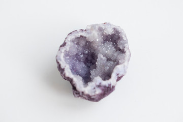 Purple quartz druse or geode mineral stone. Close up photo mineralogy and esotericism.