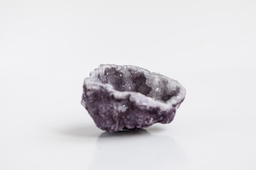 Purple quartz druse or geode mineral stone. Close up photo mineralogy and esotericism.