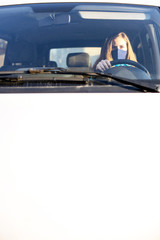 Woman wearing surgical mask in the car, for corona virus or Covid-19 protection.