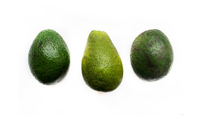 Avocado isolated on white. Three fruits. Different varieties of avocado.