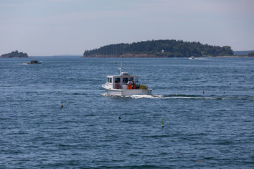 Fototapeta na wymiar Lobster Boat fishing in coatal Maine
