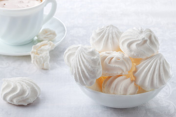 Tender, airy Bizet and a cup of fresh coffee with cream
