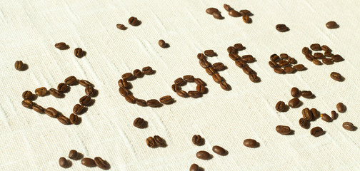 Wort coffee letters written with brown coffee beans with a heart of coffee on white background, illustration