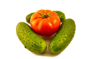 Cucumber and tomato on a white background. fresh vegetables.