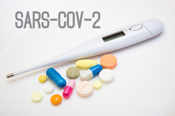 Electronic thermometer with tablets, capsules - protection, coronavirus, covid19, lettering sars-cov-2