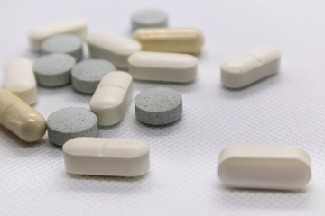 Obraz na płótnie Canvas Colored health drug pills on white background