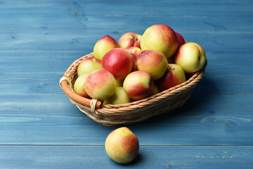 Hybrid Nectarine and Apricot Fruit Abrikotin in a basket on a rustic background
