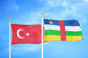 Turkey and Central African Republic two flags on flagpoles and blue cloudy sky