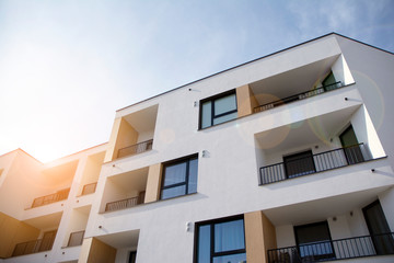 Modern apartment building flat estate concept. Outdoor residential facility at sunset and sunrise.