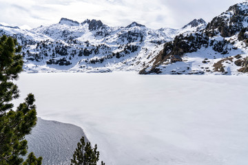 Colomers lake and refuge in National Park of Aigüestortes and lake of Sant Maurici.
