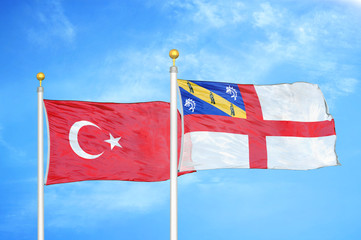 Turkey and Herm two flags on flagpoles and blue cloudy sky