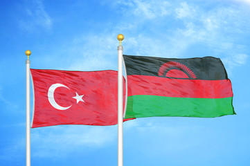 Turkey and Malawi two flags on flagpoles and blue cloudy sky