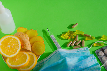 Coronavirus home treatment, medicine concept.  Stay home. Lemon and ginger,  Prevention face mask,...