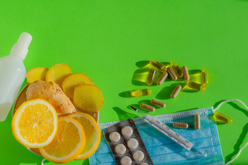 Coronavirus home treatment, medicine concept.  Stay home. Lemon and ginger,  Prevention face mask,...