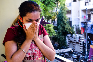 Mature woman in medical mask staying at home under quarantine - stock photo, Isolation Quarantine Coronavirus Covid 19