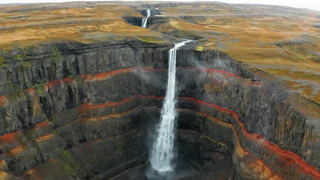 Flight over majestic Hengifoss Waterfall in Iceland