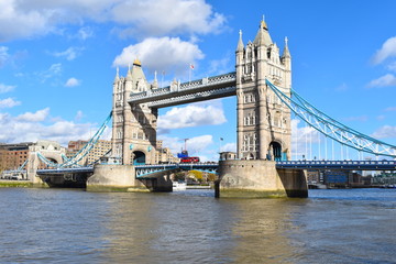 Fototapeta na wymiar Tower Bridge is a combined bascule and suspension bridge with a glass floor and modern exhibitions It crosses the river Thames close to the Tower of London and has become an iconic symbol of the city 