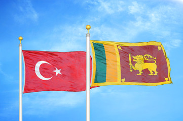 Turkey and Sri Lanka two flags on flagpoles and blue cloudy sky