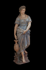 Isolate - a stone figure of a woman with a water pitcher on a black background.