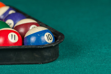Billiards balls and cue on billiards table. Billiard sport concept