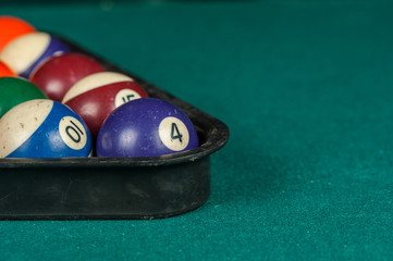 Billiards balls and cue on billiards table. Billiard sport concept