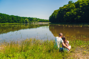 Loving couple fishing on a lake