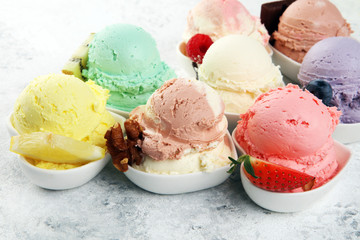 Various of ice cream flavor whit fresh blueberry, strawberry, kiwi, lemon, vanilla setup on rustic background . Summer and Sweet cold ice cream
