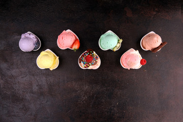 Various of ice cream flavor whit fresh blueberry, strawberry, kiwi, lemon, vanilla setup on rustic background . Summer and Sweet cold ice cream
