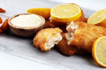 traditional British fish and chips consisting of fried fish, potato chips and mayonnaise