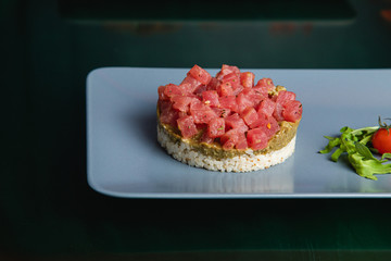 tartar with rice and sauce, tartar in a restaurant