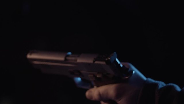 Stock video footage firearm put a clip in the gun